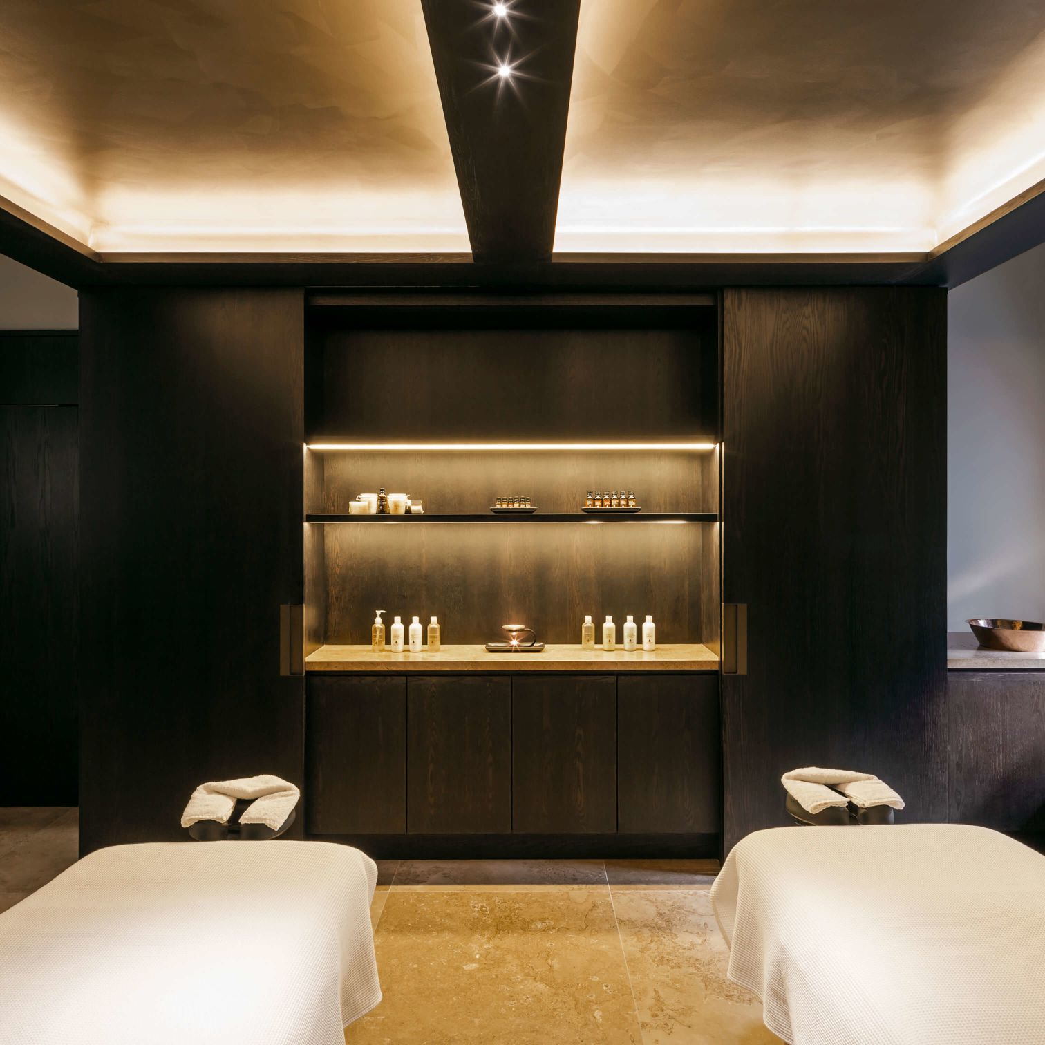 A Room With A Shelf And A Bed