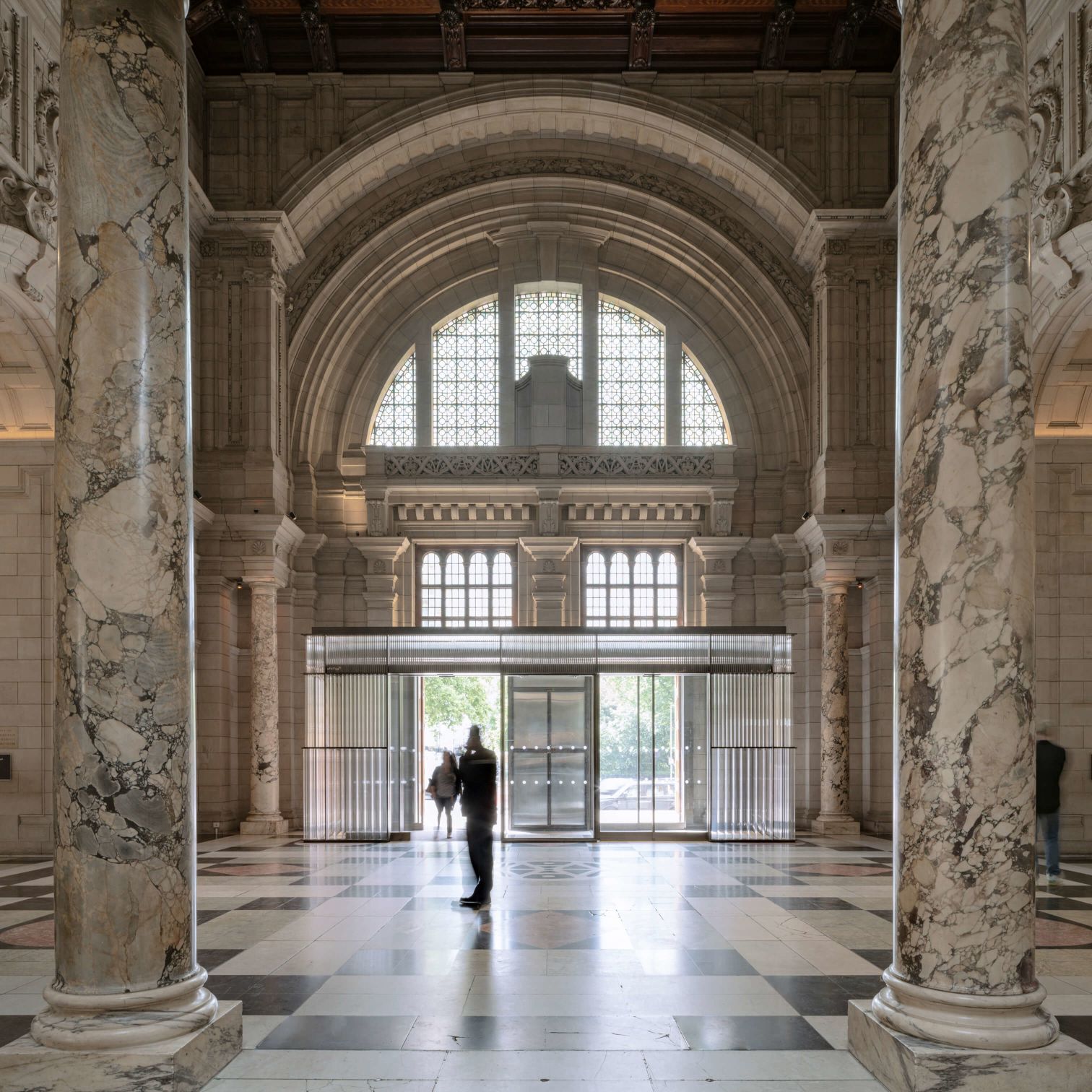 A Person Walking In A Large Building