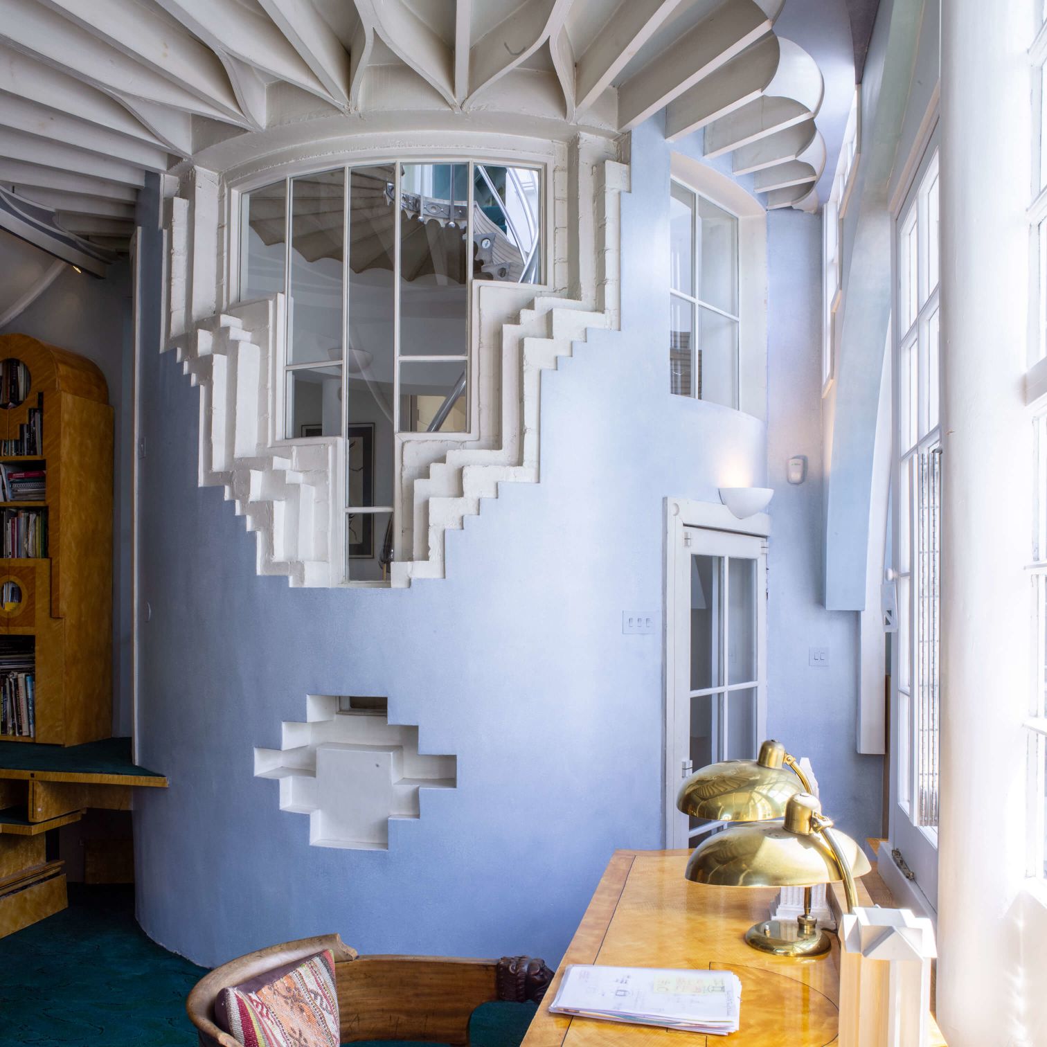 A Room With A Desk And A Chair