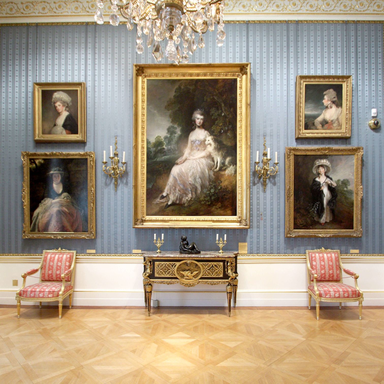 A Room With A Wall Of Paintings