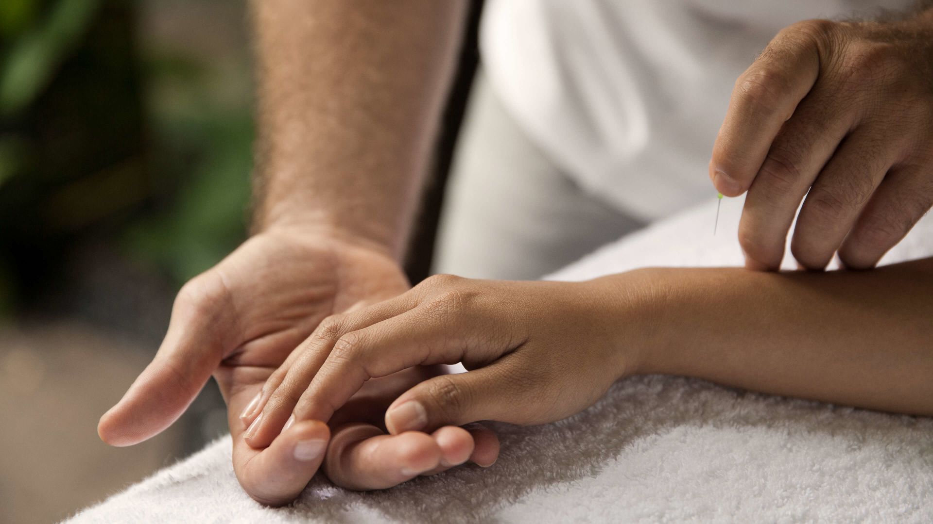 A Close-up Of Hands Holding A Baby's Feet