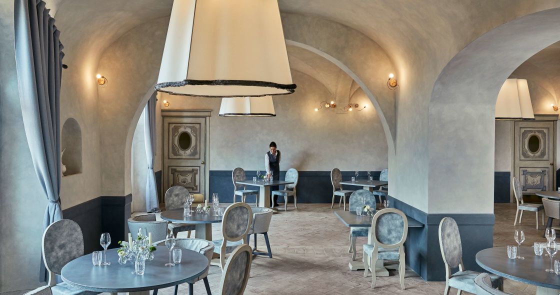 A Room With Tables And Chairs