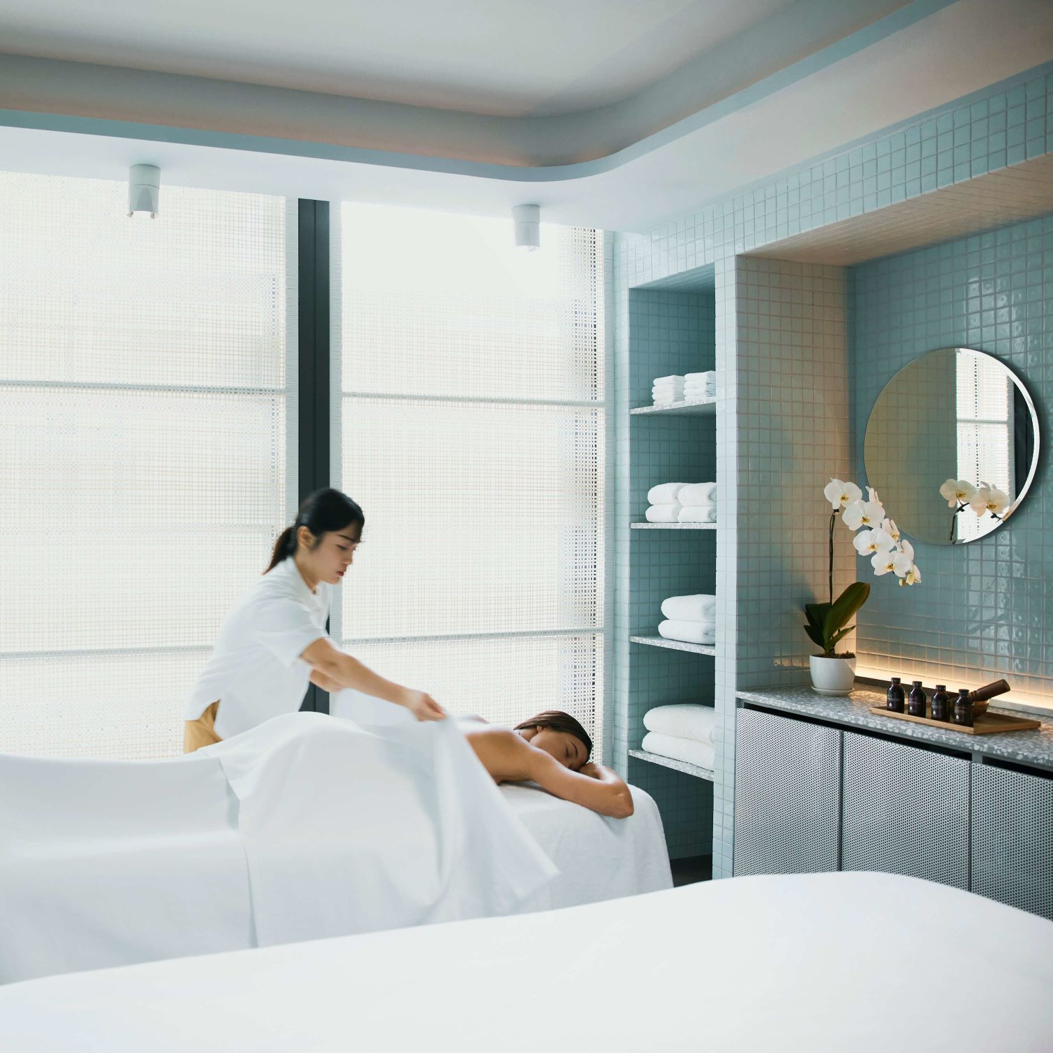 A Person Sitting On A Bed