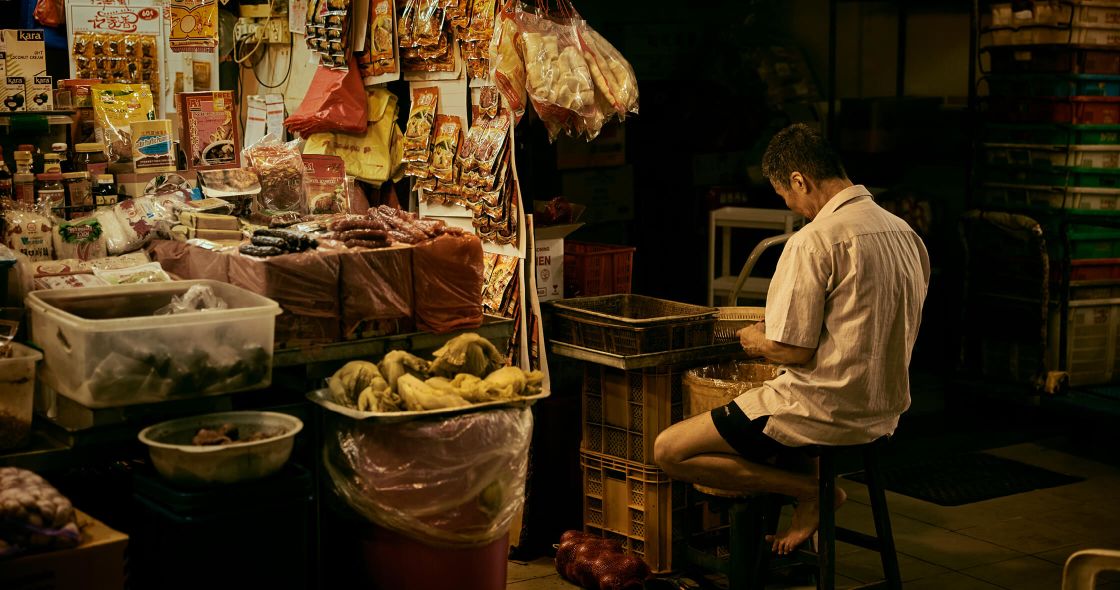 A Person Sitting In A Shop