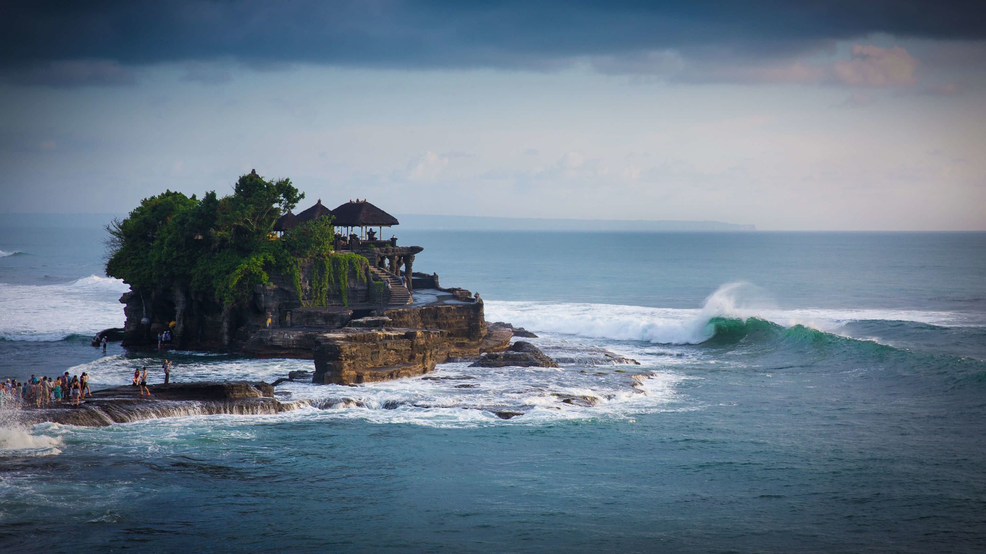 A Small Island With Tanah Lot On It Surrounded By Water