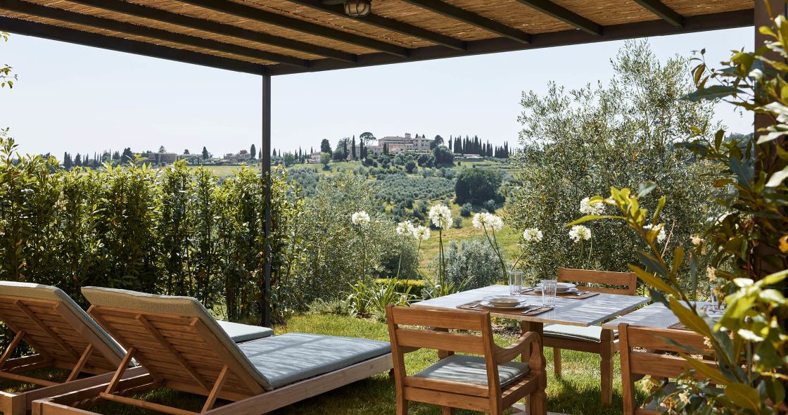 A Table And Chairs On A Deck