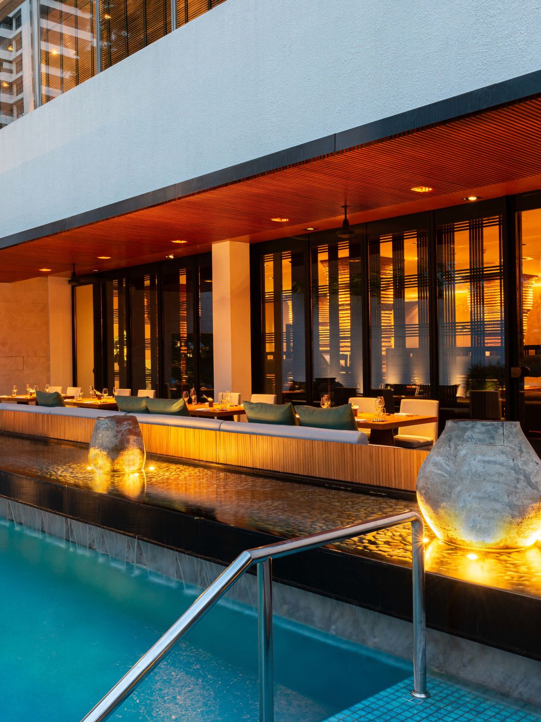 A Pool With A Building In The Background
