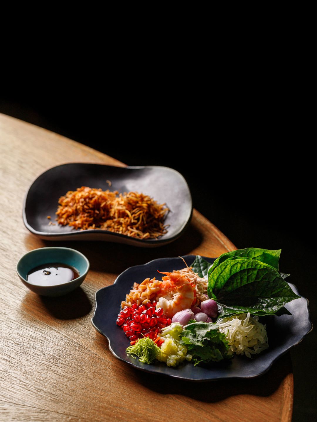 A Plate Of Food And A Bowl Of Salad