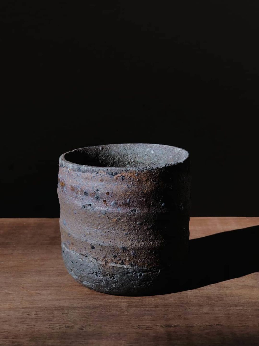 A Grey Cup On A Wood Surface