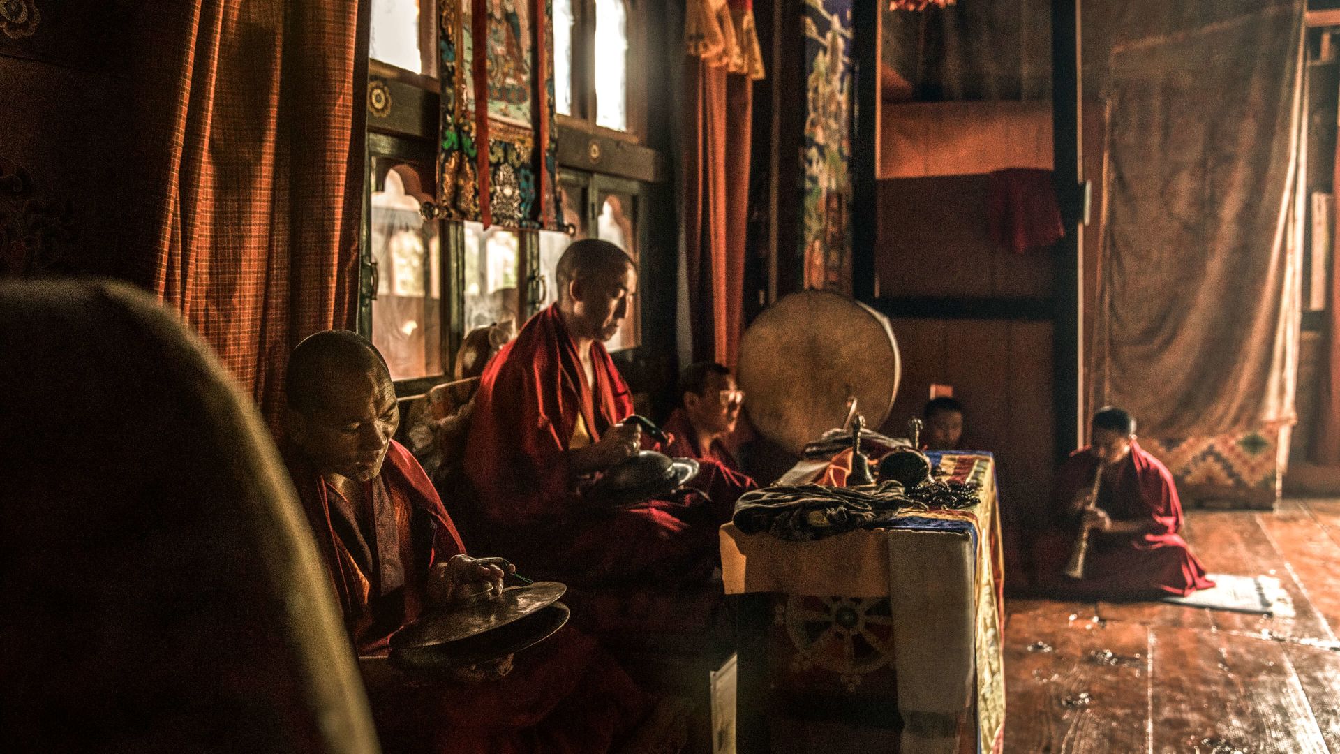 A Group Of People Sitting In A Room