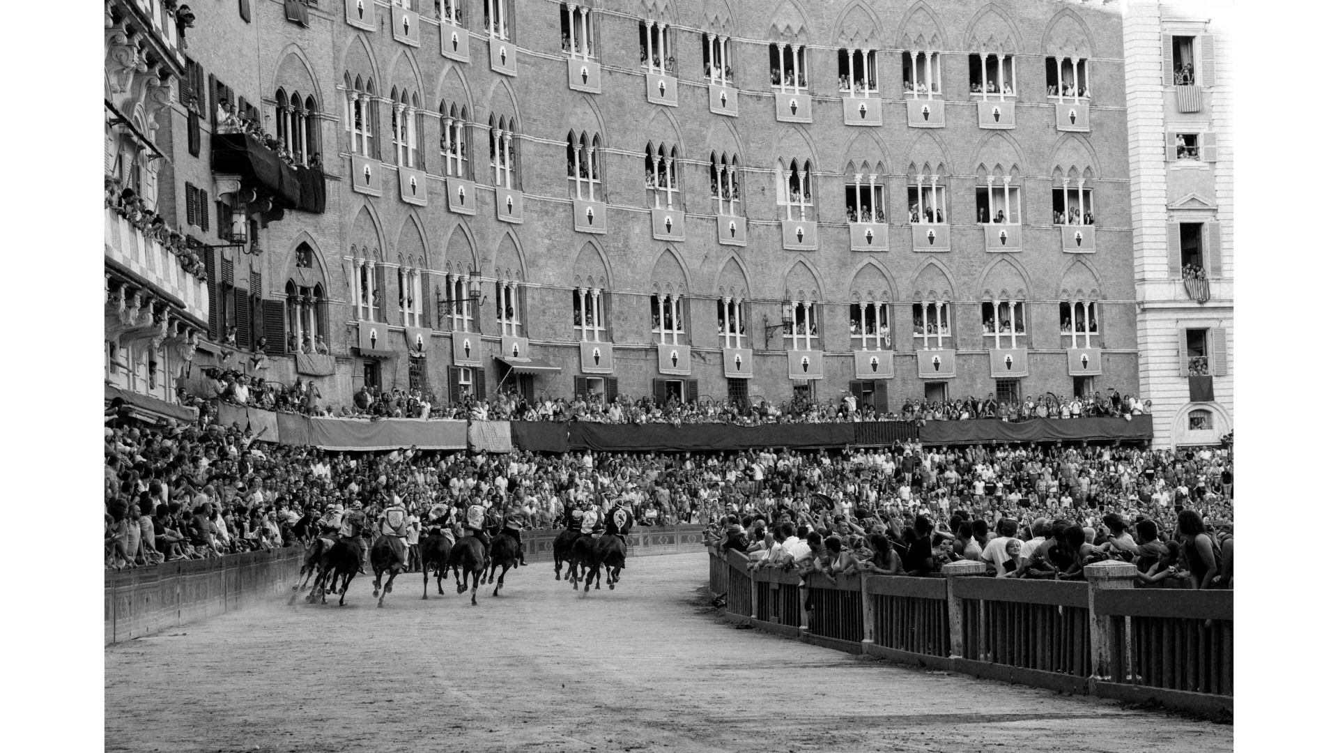 A Large Crowd Of People In Front Of A Building
