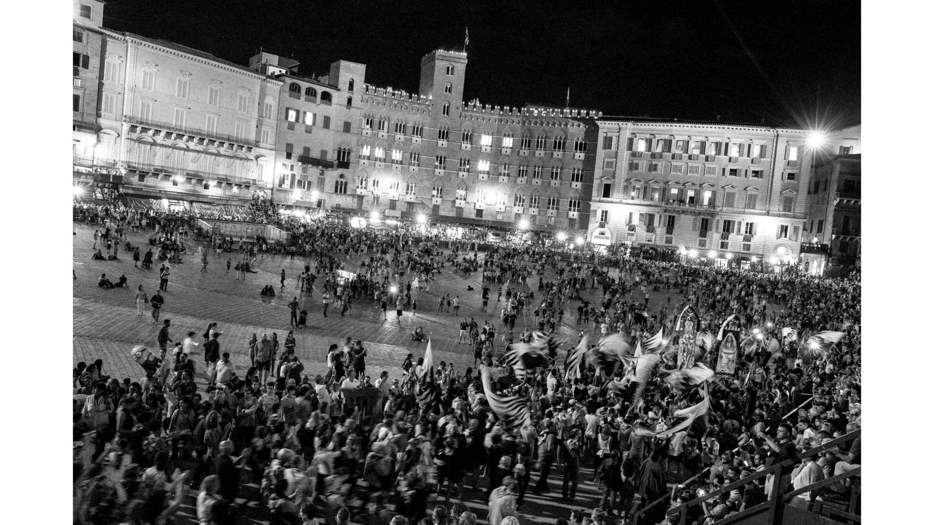 A Large Crowd Of People In Front Of A Building