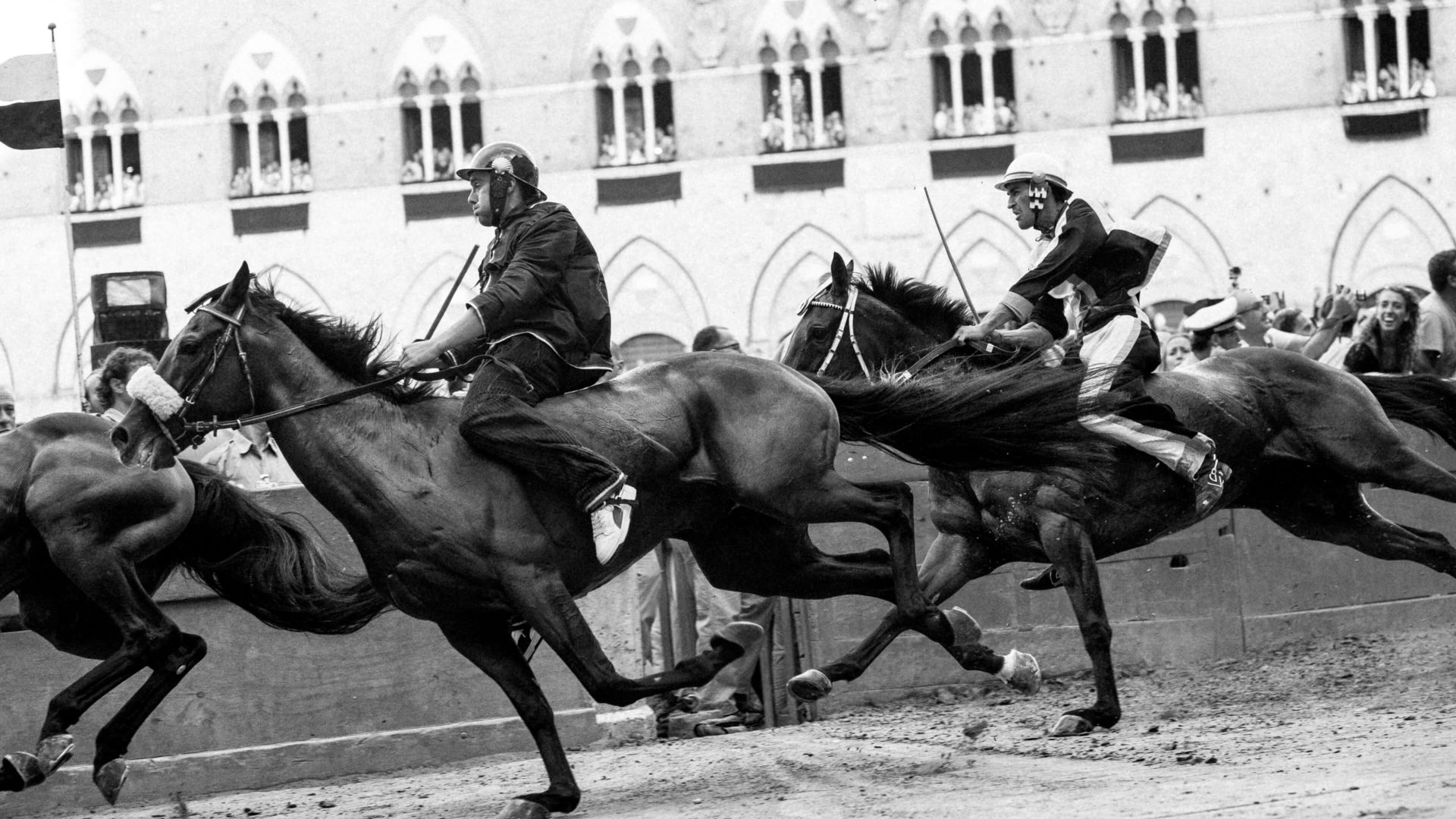 A Group Of Men Riding Horses