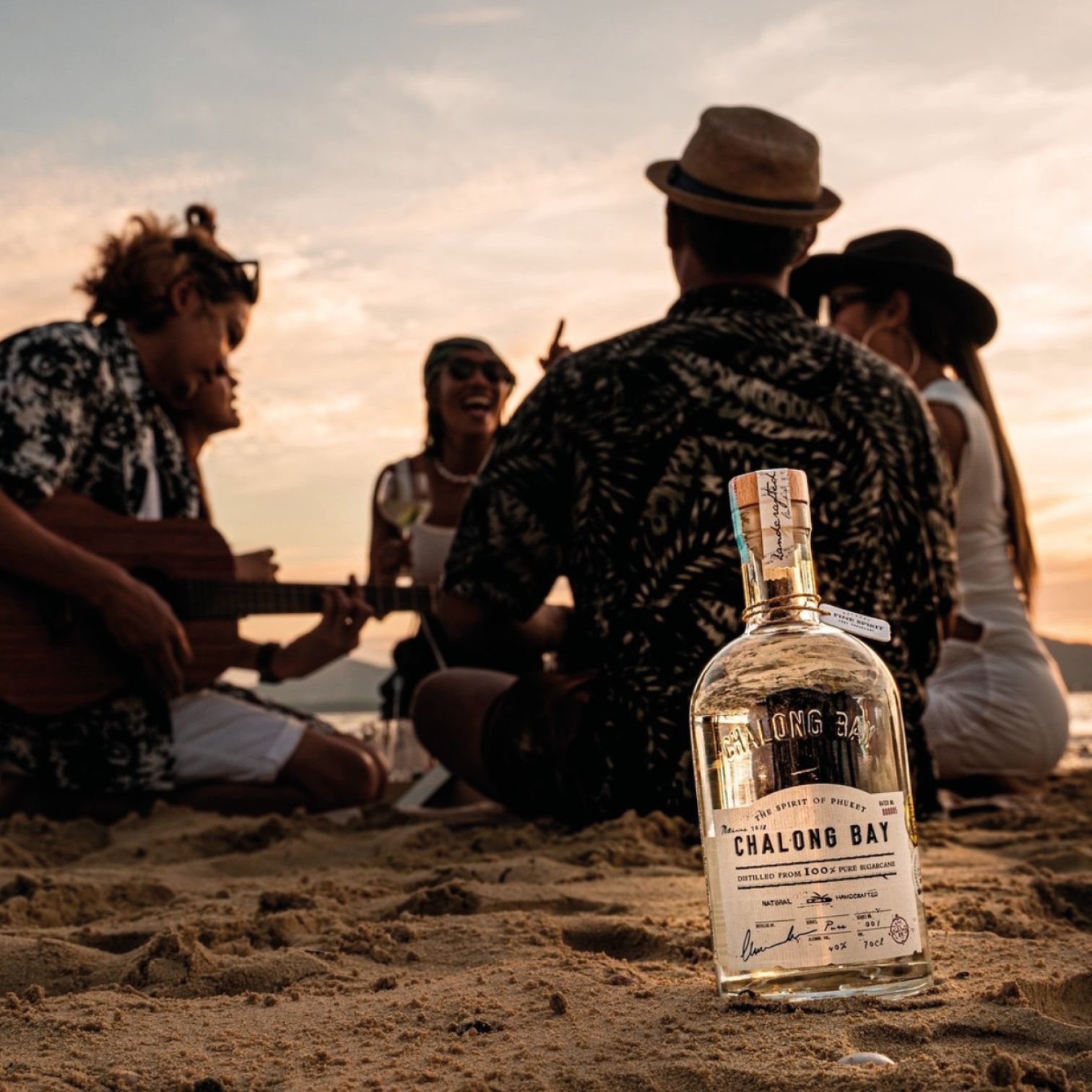 A Person Holding A Bottle Of Alcohol
