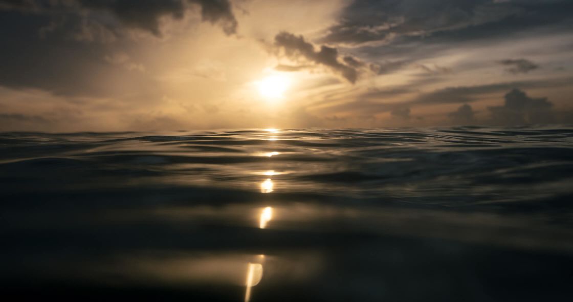 A Sunset Over A Body Of Water