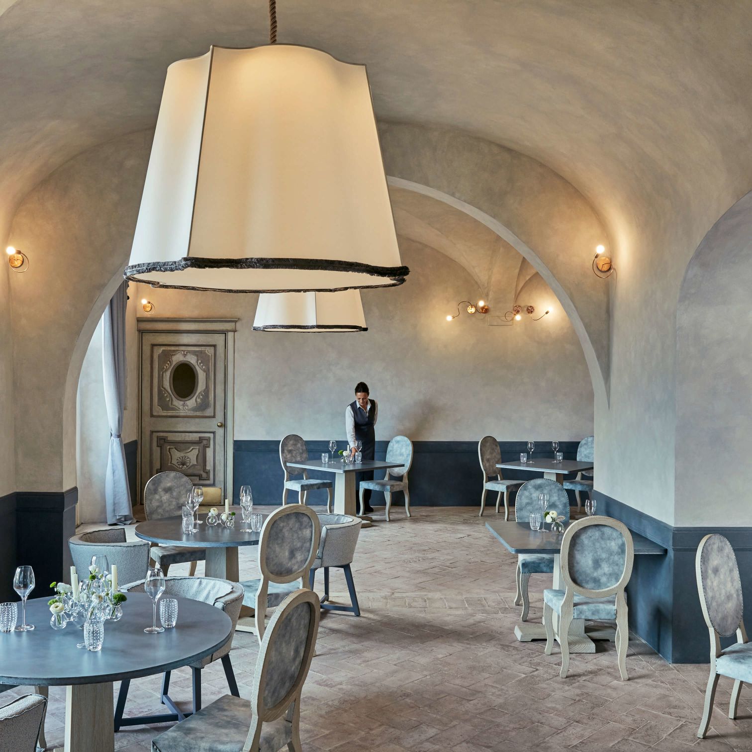 A Room With Tables And Chairs