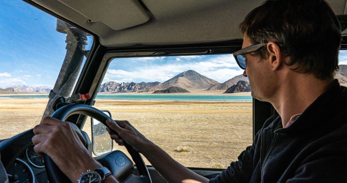 A Man Driving A Car