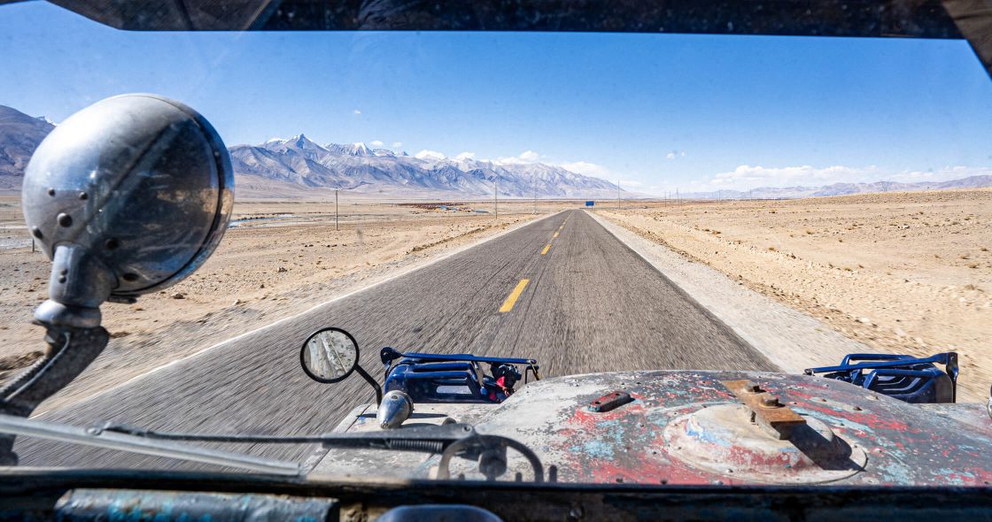 A Car Driving On A Road