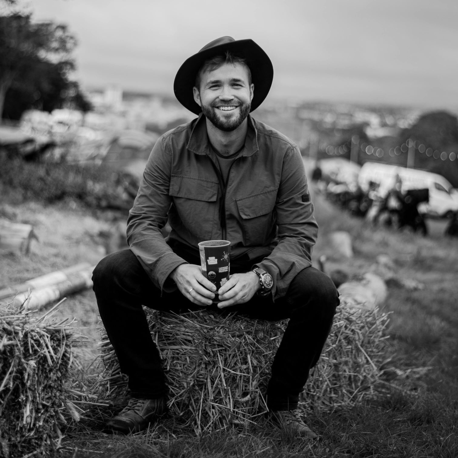 A Man Sitting On A Hill