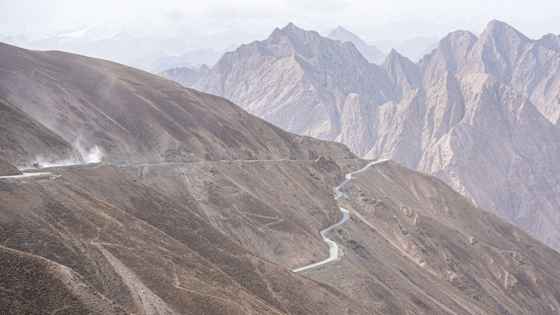 A Winding Road Through A Valley