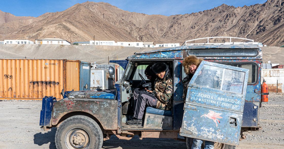 A Couple Of People In A Truck