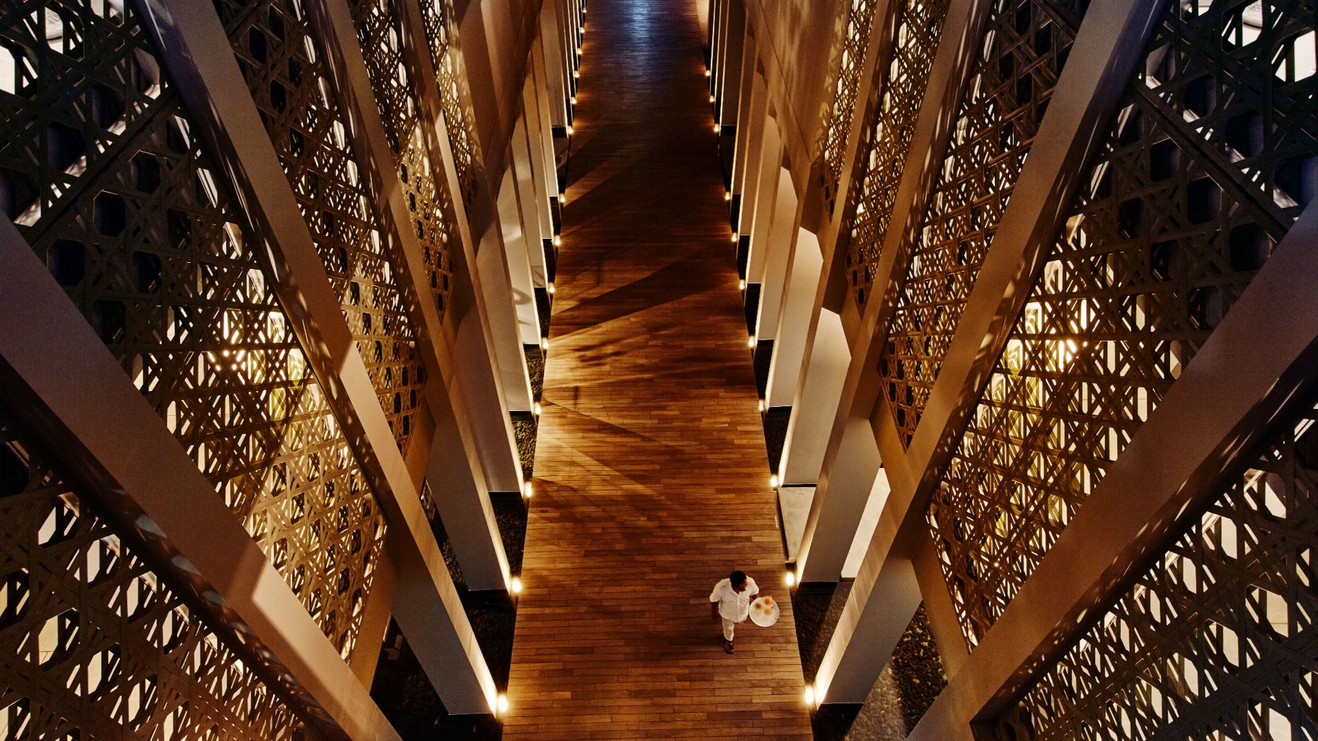 A Person Walking Down A Flight Of Stairs