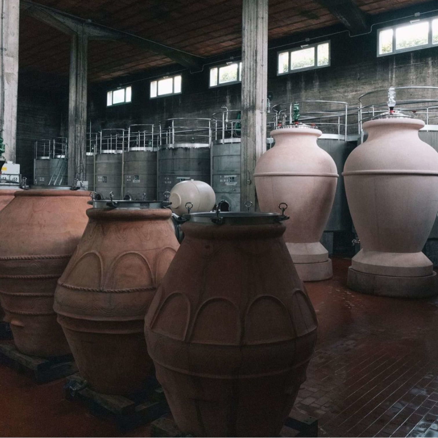 A Group Of Vases Sit In A Room