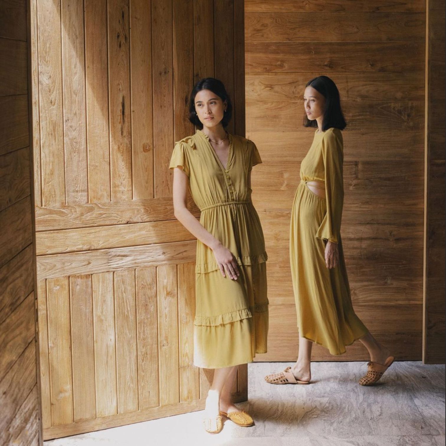 A Couple Of Women In Dresses