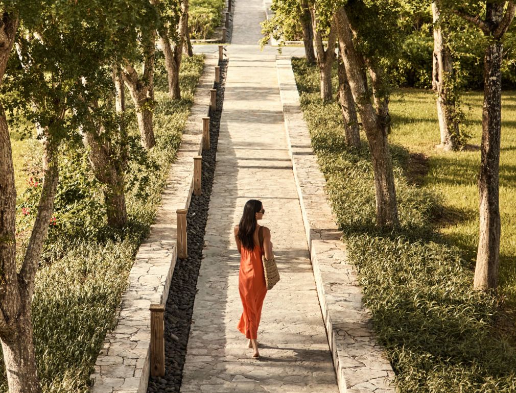 A Person Walking Down A Path