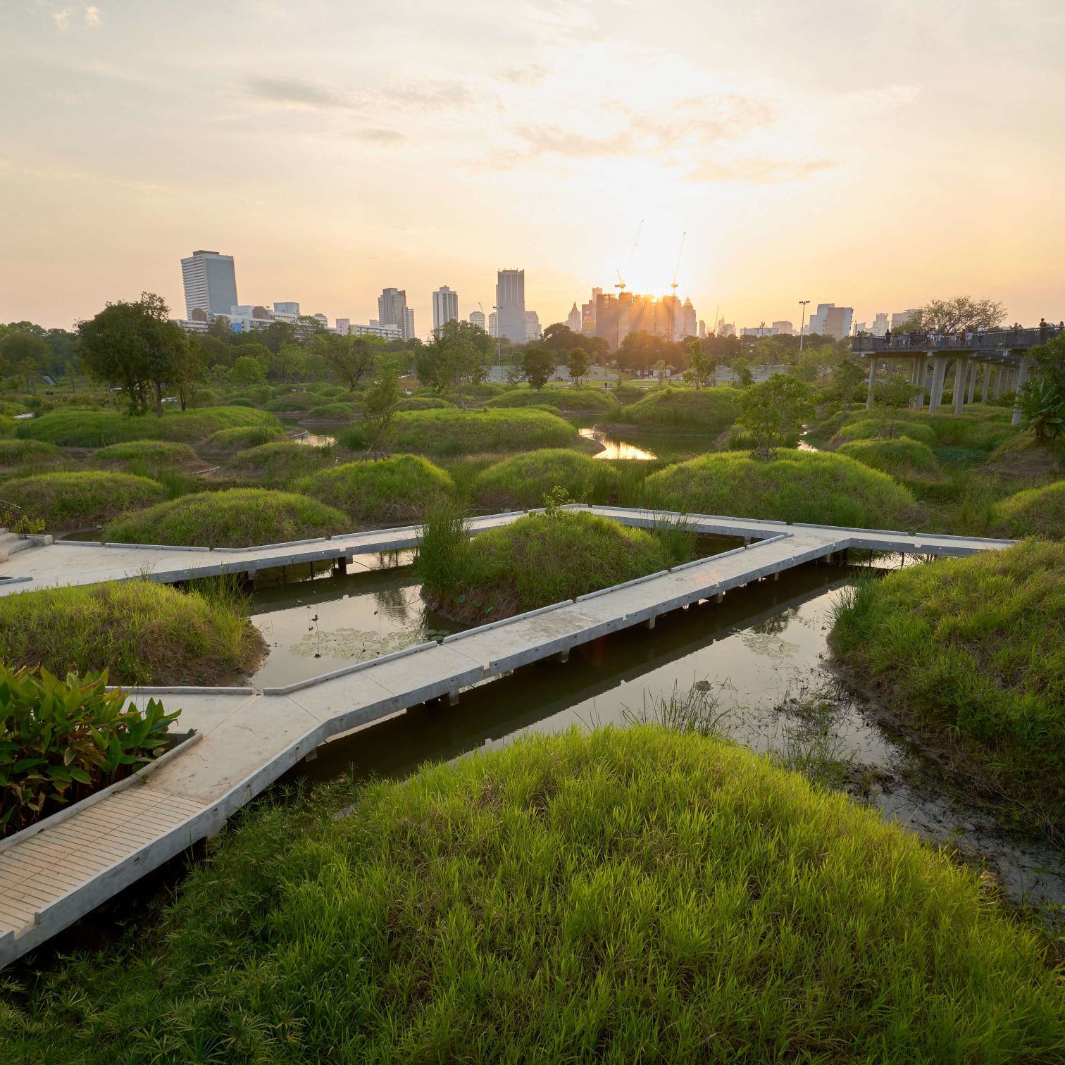 A River With A Bridge And A City In The Background