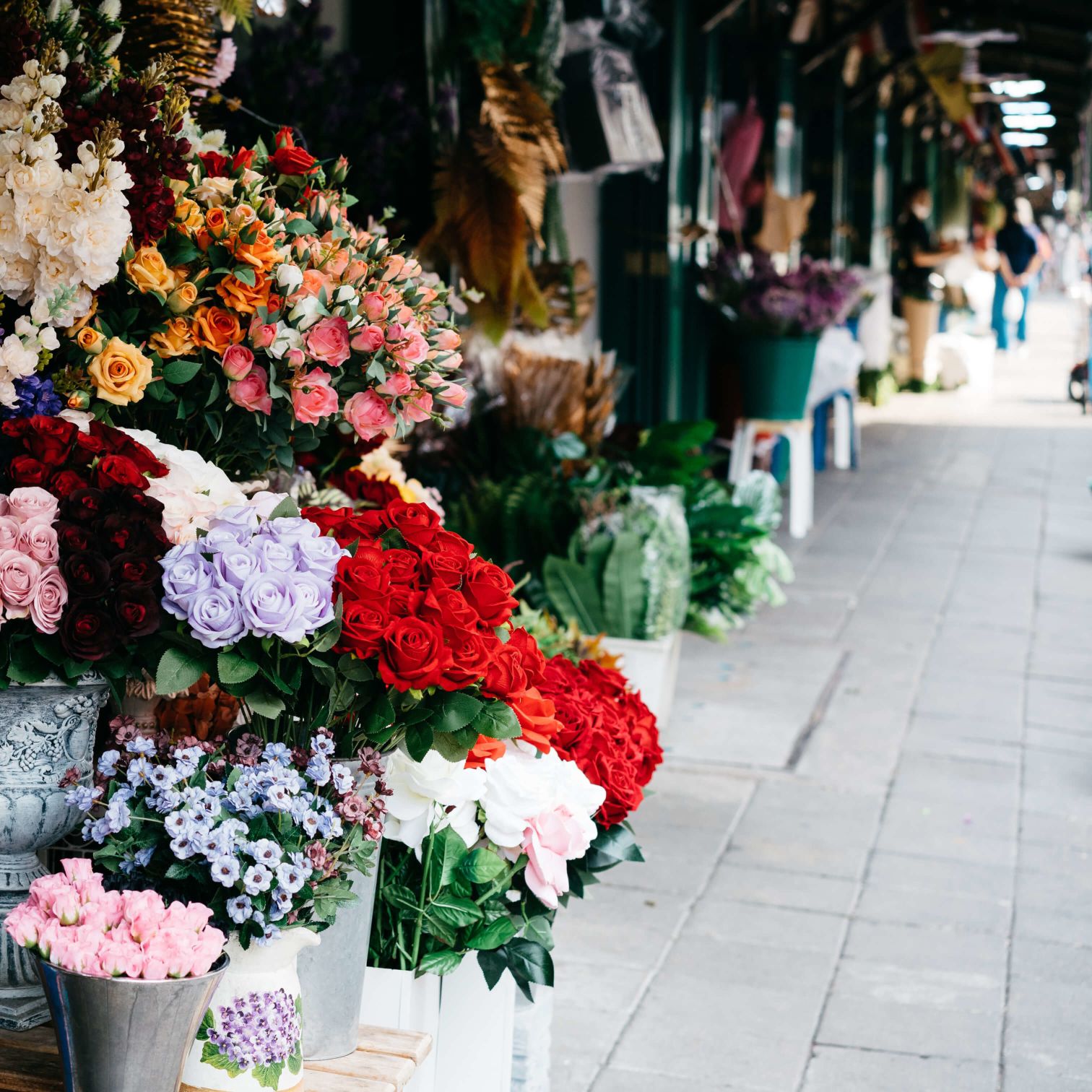 A Group Of Flowers In A Flower Shop
