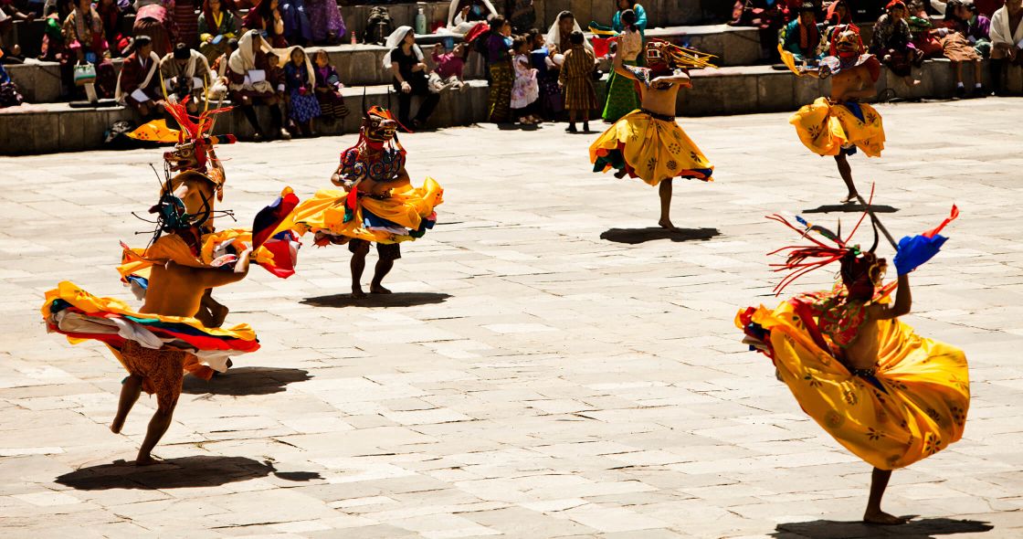 A Group Of People In Clothing Dancing