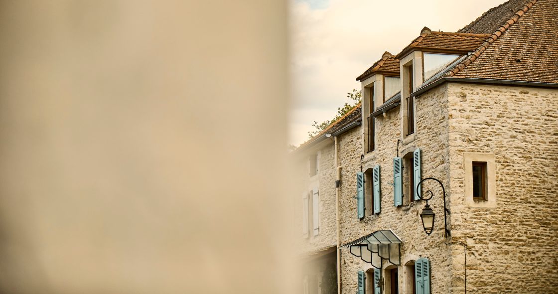 A Stone Building With Windows