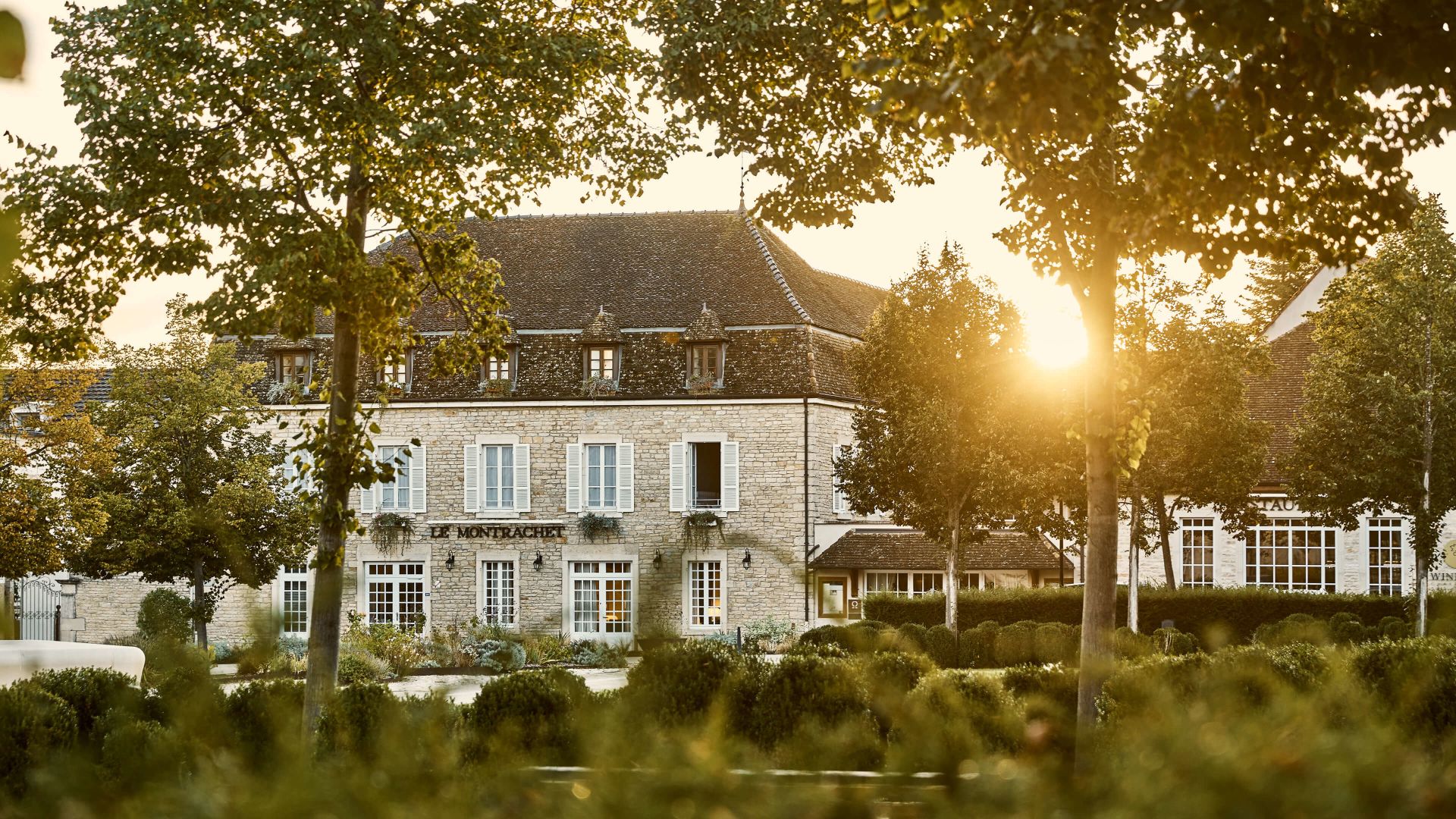 A Building With Trees In Front Of It