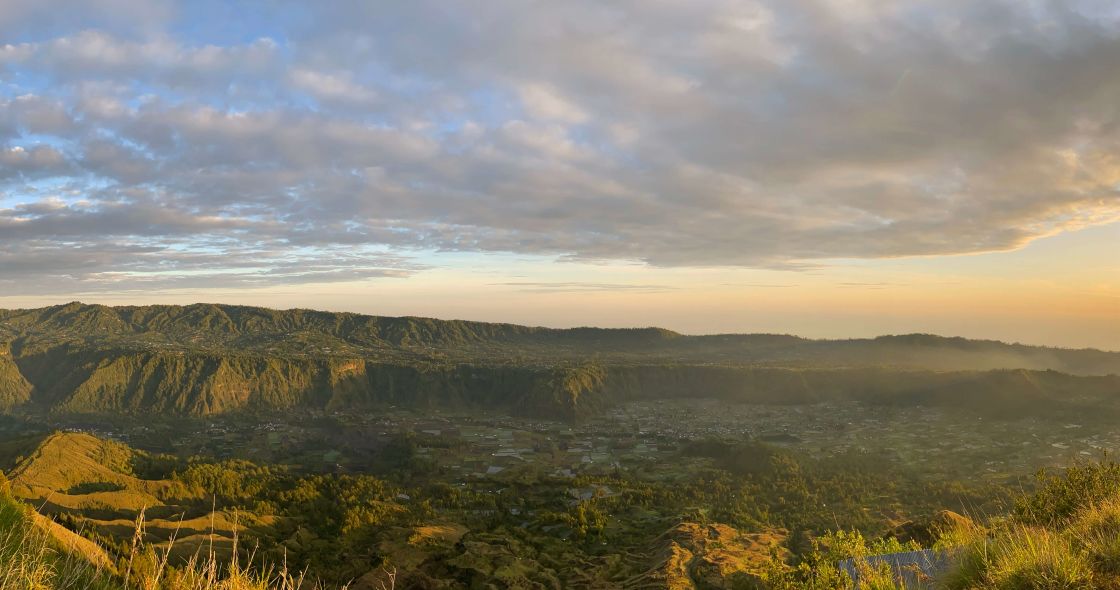 A Landscape With Trees And Hills