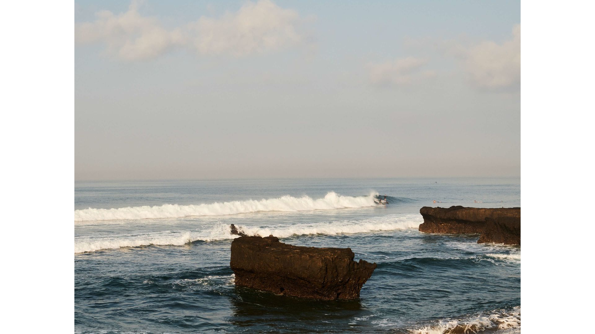A Body Of Water With Rocks In It
