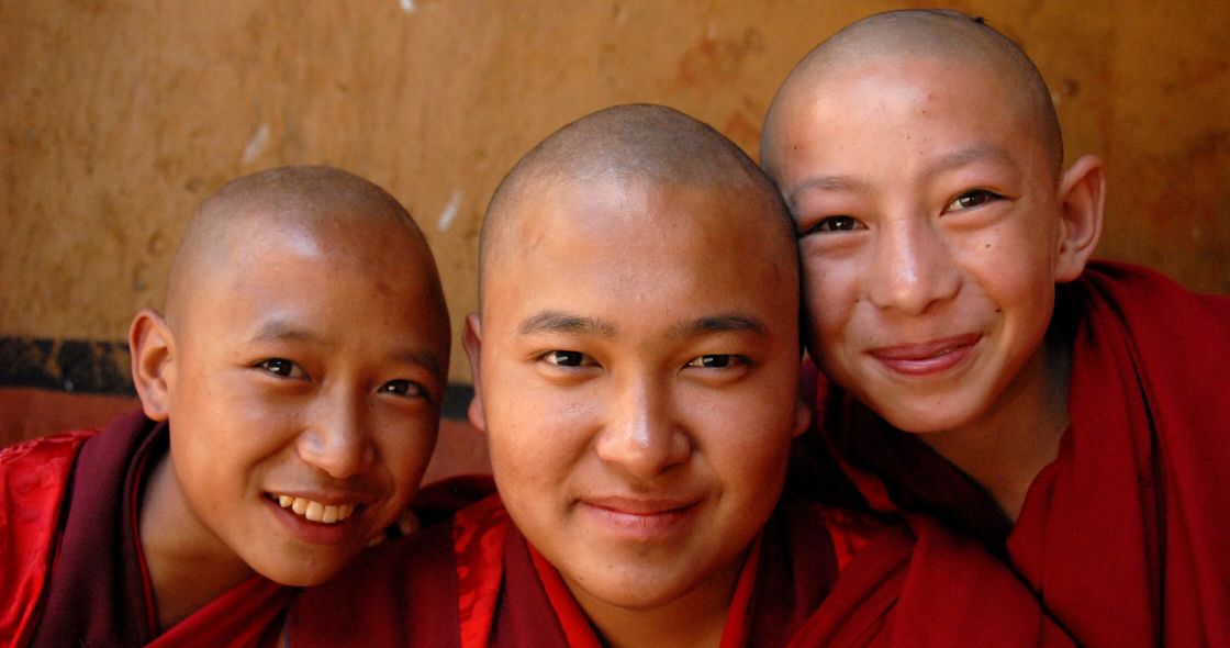 A Group Of People Posing For The Camera