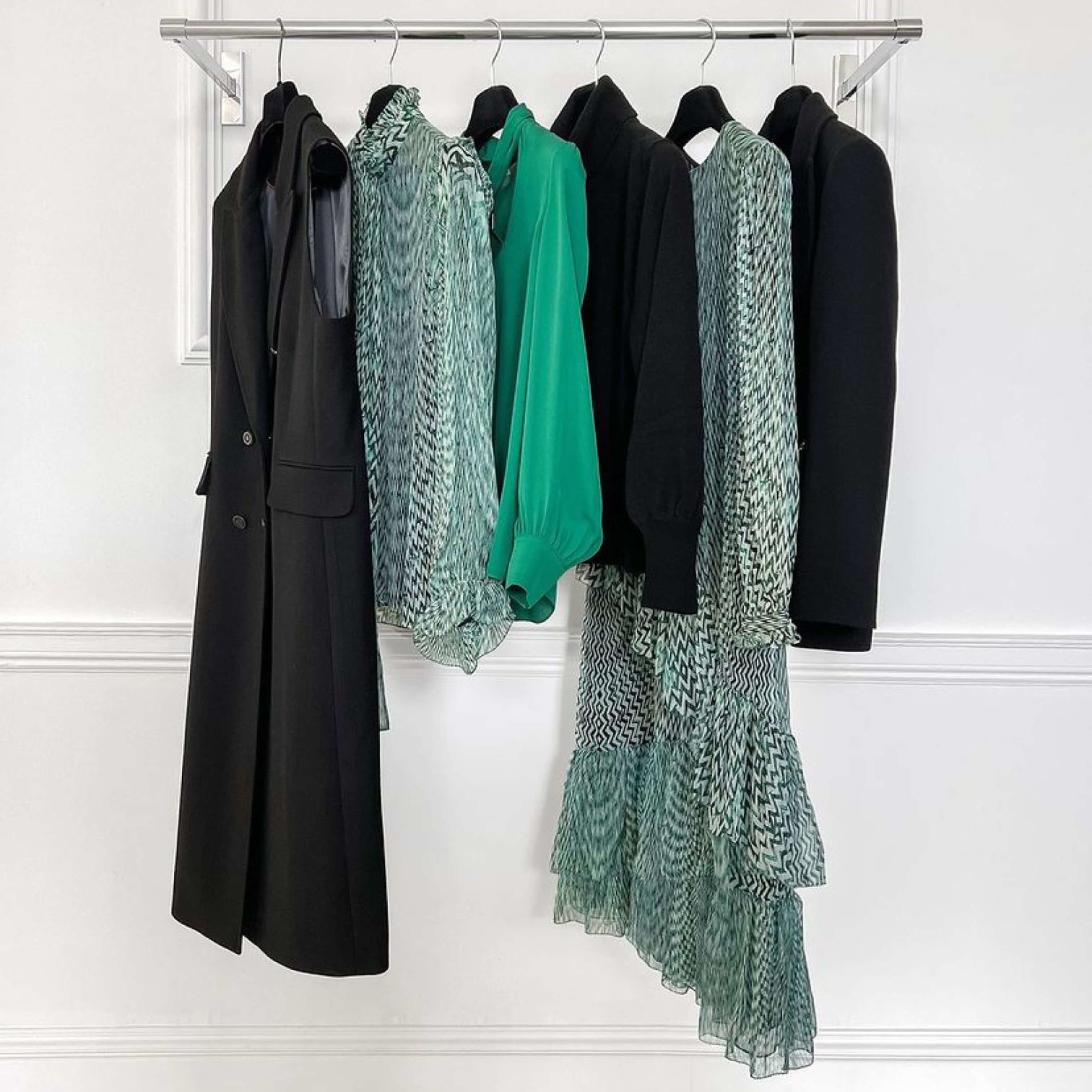 A Group Of Clothes On A Rack