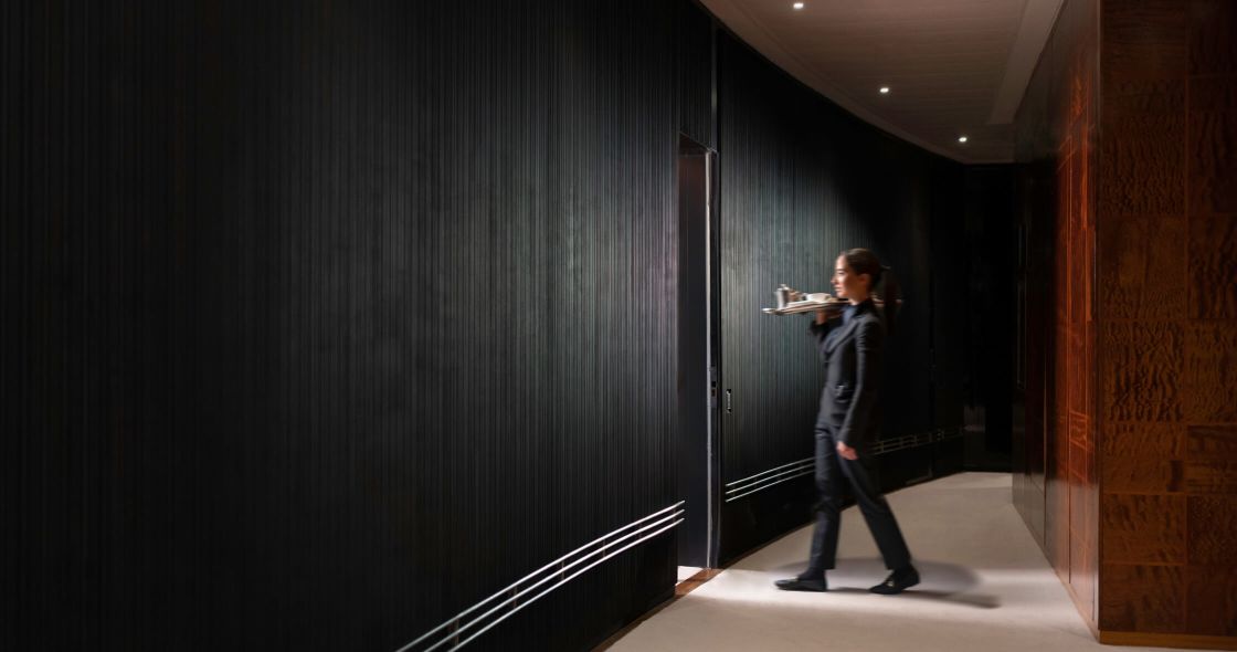 A Person Walking In A Hallway