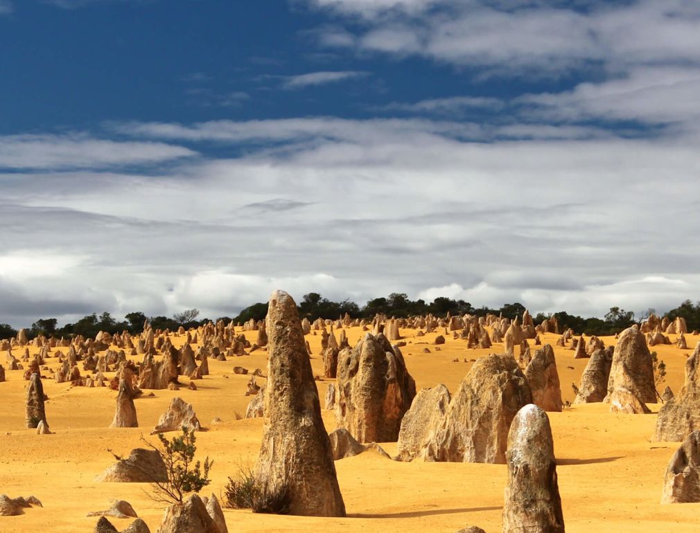 A Group Of Rocks In A Desert