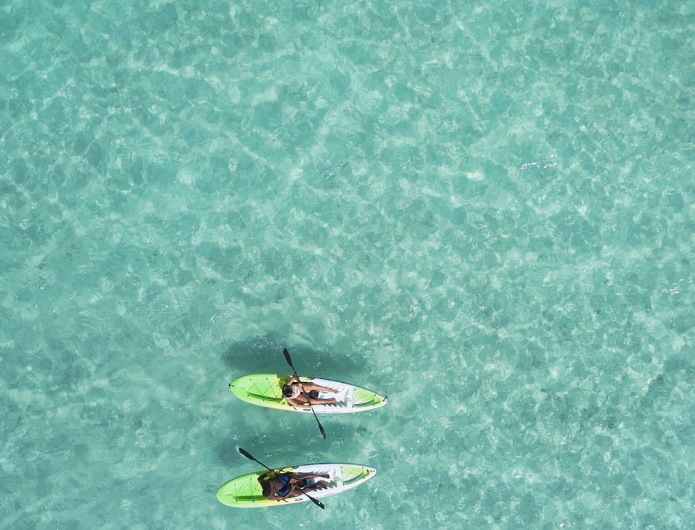 A Couple Of People In A Boat