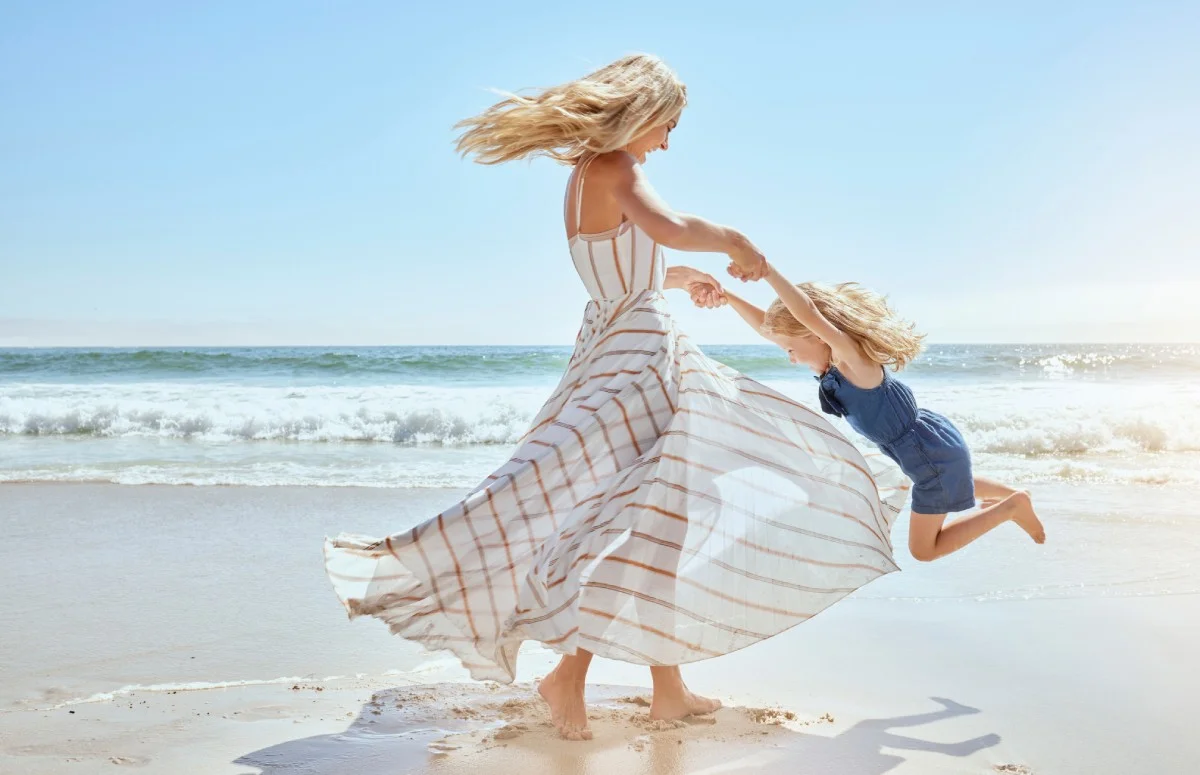 Mom with daughter on the beach