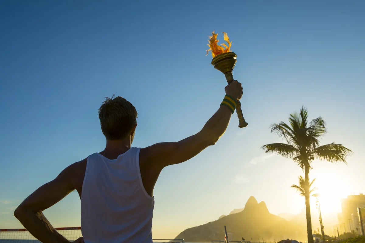 Man holding the Olympic flame © shutterstock
