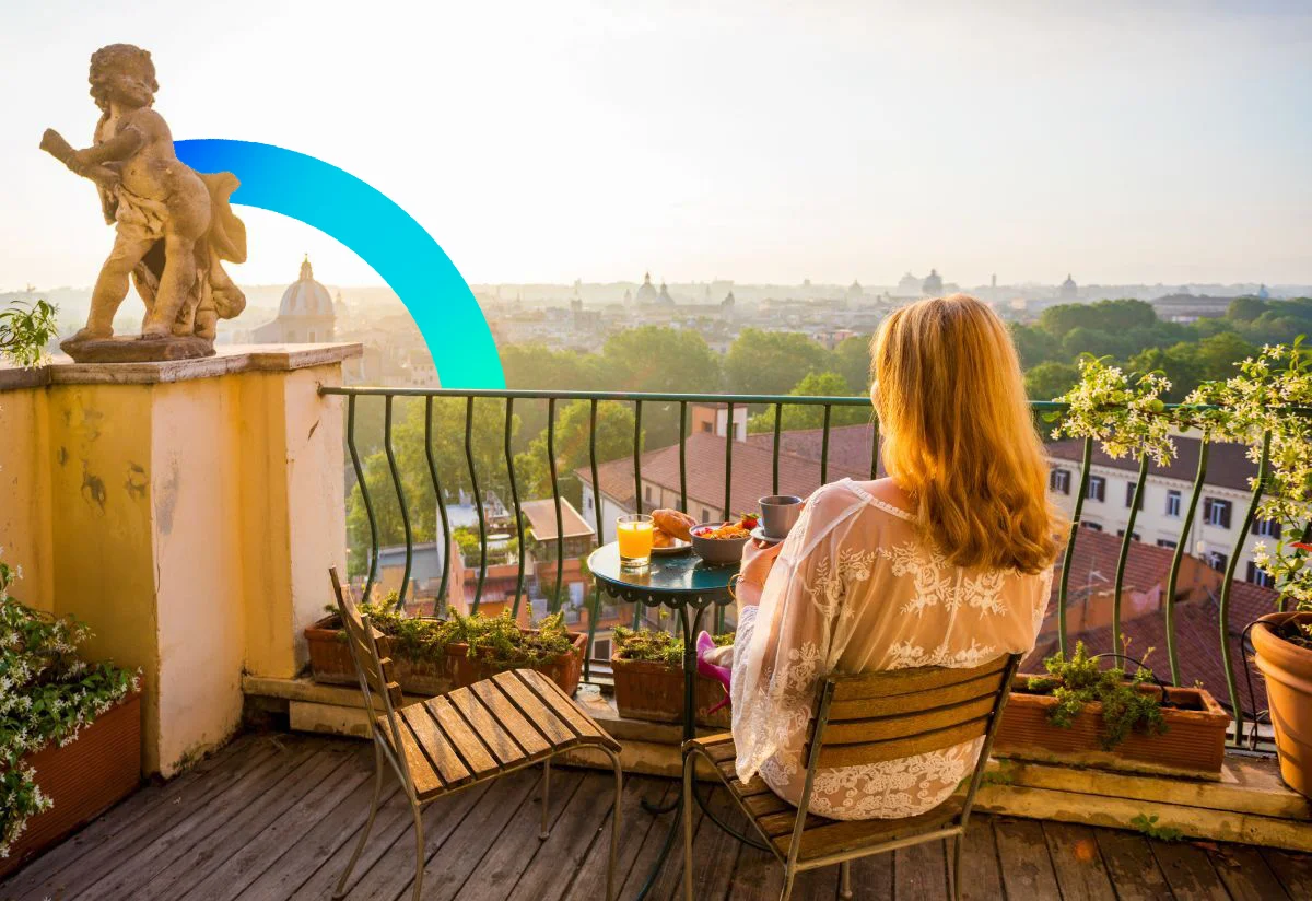 Woman enjoying the Italian view while driking coffee © iStock